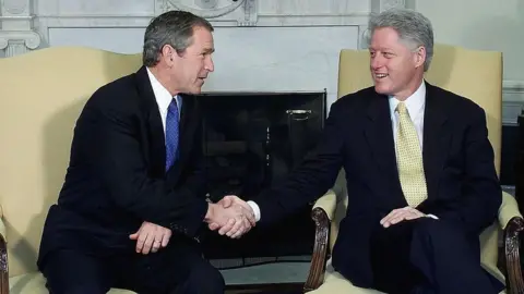 Getty Images Presidents Clinton and George W Bush inside the White House