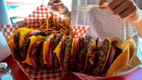 Getty Images A huge stacked burger and fries