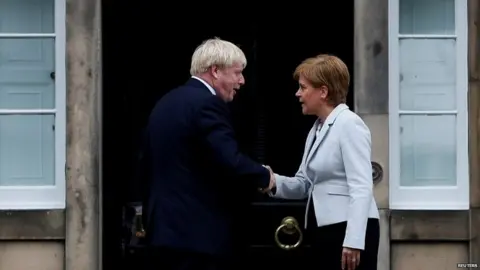 Reuters Nicola Sturgeon greets Boris Johnson outside her official residence in Edinburgh in July 2019
