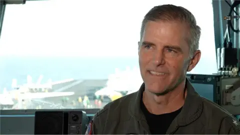 BBC/Maarten Lernout Rear Admiral Marc Miguez, Carrier Strike Group Commander