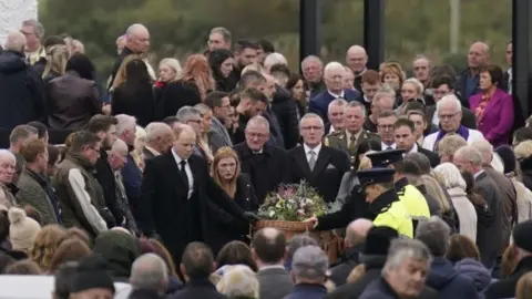 PA Media Mourners gathered around the coffin of Jessica Gallagher outside St Michael's Church in Creeslough
