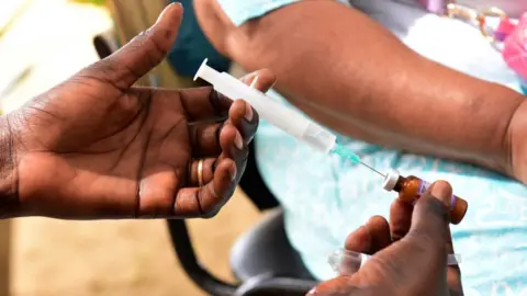 AFP/Getty A nurse preparing to inject a measles vaccine in Senegal