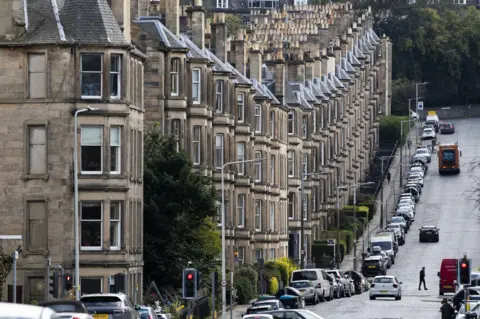 PA Media A view of traditional tenement flats in Edinburgh