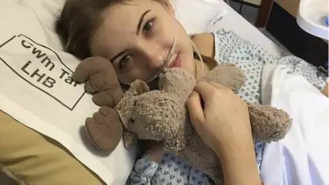 @amberostomy Amber in a hospital bed