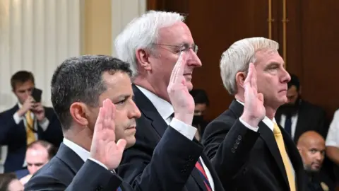 Getty Images Richard Engel, Jeffrey Rosen and Richard Donoghue are sworn in Thursday before the 6 January committee