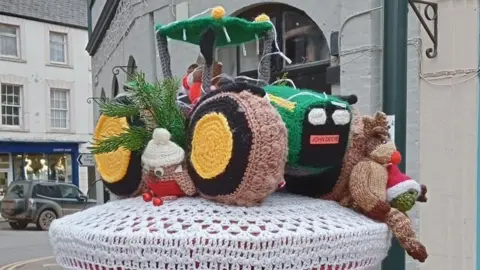 Wivey Square Post Box A knitted tractor on a postbox