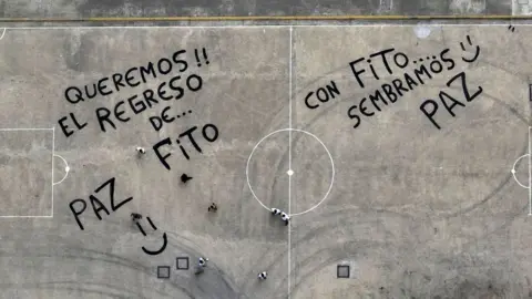 Getty Images Aerial picture showing inmates during a protest demanding the return to this prison of the leader of the "Los Choneros" gang, alias Fito, at the Zonal Penitentiary No. 8 in Guayaquil, Ecuador, taken on August 14, 2023.