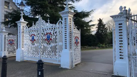 BBC Ornate white metal gates