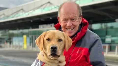 Allen Parton with his dog ET