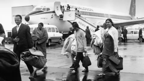 Getty Images Ugandan Asians arriving in the UK