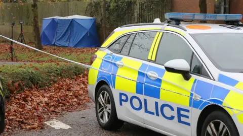 SOUTH BEDS NEWS AGENCY Forensics tent and police car