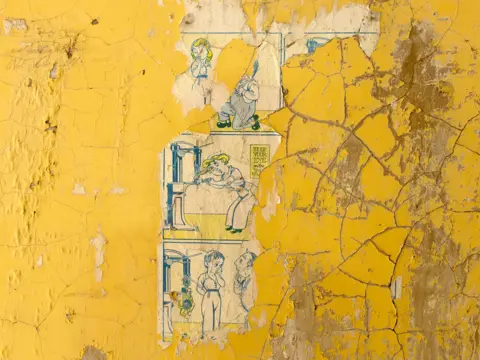 Dara McGrath Old posters on a wall at Rhydymwyn, Flintshire