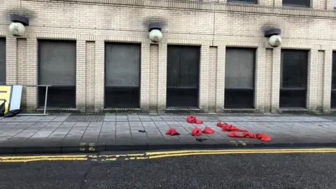 Zero Waste Scotland Santa costumes discarded on floor