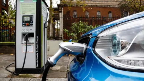Getty Images Electric car being charged on a London street