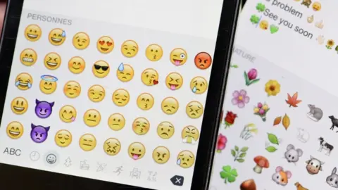 Getty Images Emoji icons on smartphone screen