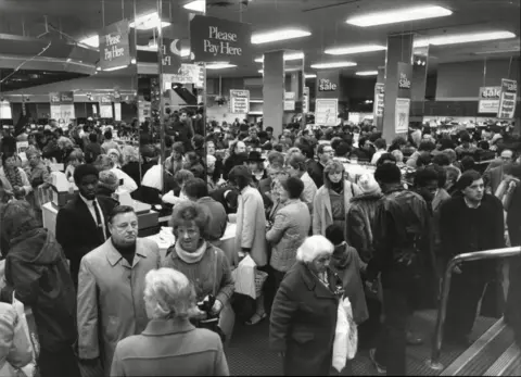 Shutterstock A crowd of shoppers in a Debenhams store