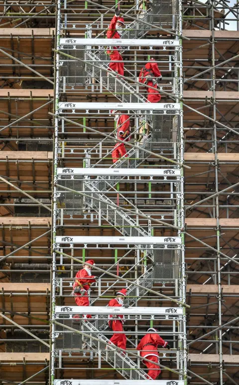 PA Media Santas erecting scaffolding around the Wellington Monument