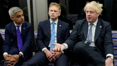 PA Media Sadiq Khan, Grant Shapps and Boris Johnson