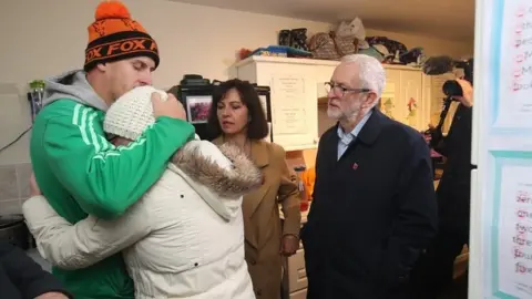 Getty Images Jeremy Corbyn with flood victims in Conisborough