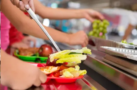 Getty Images School meals being dished out