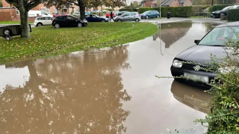 Mia Griffiths Flooding shown in McCreery Road in Sherborne, Dorset