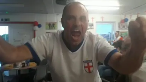 An England fan celebrating the win