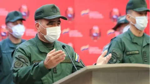 EPA A handout photo made available by Miraflores Press showing the Venezuelan Defense Minister, Vladimir Padrino Lopez, during the transmission of a statement, in Caracas, Venezuela, 15 May 2021.