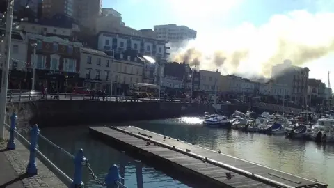 Ian Morgan Smoke blowing across Torquay harbour