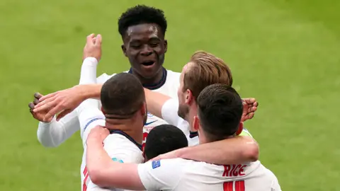 Getty Images Bukayo Saka celebrates with England players in the match against Czech Republic