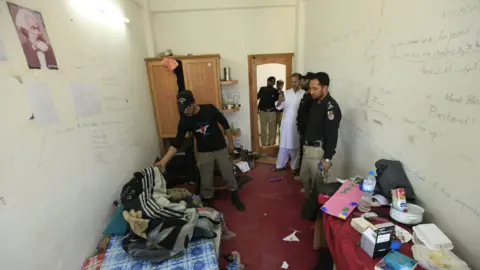 EPA Pakistani security officials survey the room of student Mashal Khan at Abdul Wali Khan University, where he was killed by a mob of his fellow students for alleged blasphemy in Mardan