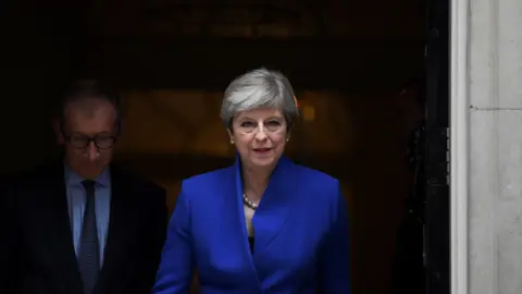 Getty Images Theresa May leaves 10 Downing Street in central London on June 9, 2017, en route to Buckingham Palace to meet Queen Elizabeth II