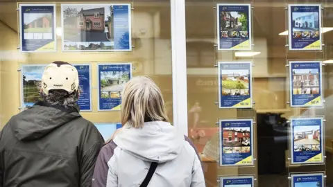 Getty Images People looking at houses