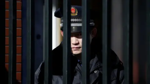 Reuters A security guard at the Beijing kindergarten