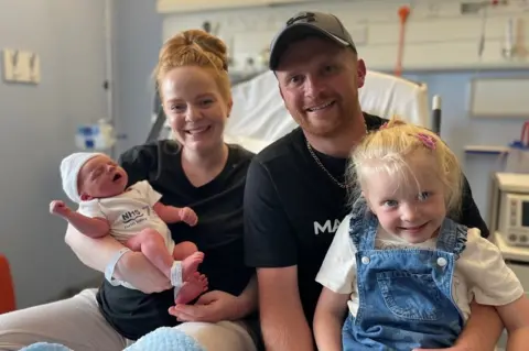 Louise and Mark Love with daughter Avery and newborn Carter