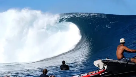 Tucker Wooding Tom Lowe at Teahupo'o