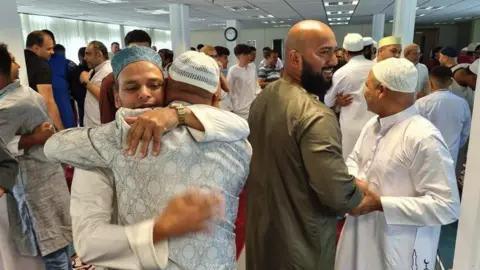 Haverfordwest Central Mosque  members of the community breaking a fast at an Iftar