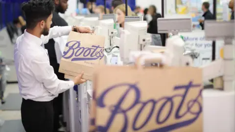 BOOTS Boots paper bags in a shop