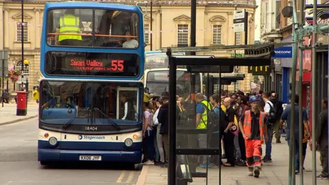 BBC Stagecoach bus with passengers queuing to get aboard