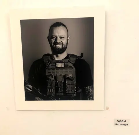 Aleksei Bobrovnikov Adam's portrait hangs in the Sophia Centre in Kyiv as part of the "Warriors of the World - Warriors of Light" exhibition