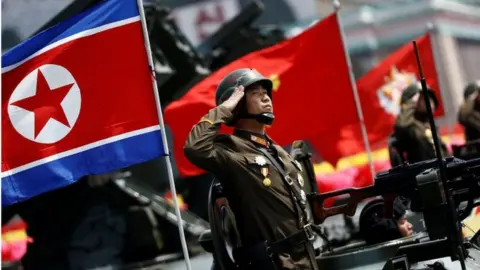 Reuters Korean People's Army soldier saluting during a parade for the "Day of the Sun" festival on Kim Il Sung Square in Pyongyang, North Korea, 15 April 2017.