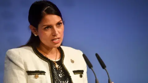 PA Media Home Secretary Priti Patel