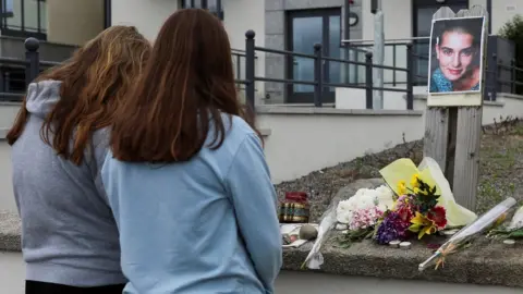 Reuters People gather outside the former home of Sinead O'Connor in the seaside town of Bray in County Wicklow, Ireland