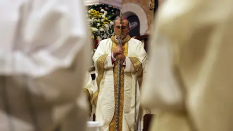 EPA Christmas midnight mass in the Church of the Nativity, in Bethlehem in the West Bank, 25 December 2019