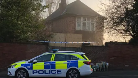 Police car outside property