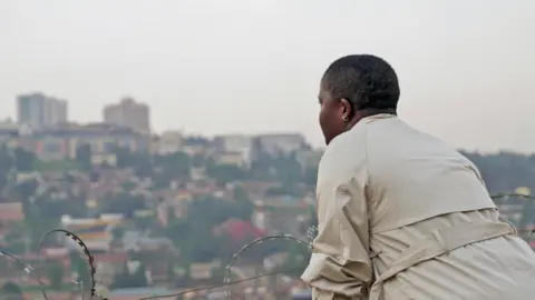Victoria Uwonkunda looking over Kigali, Rwanda - 2024