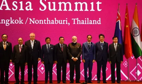 Getty Images (From L to R) Thailand's Prime Minister Prayut Chan-O-Cha, Vietnam's Prime Minister Nguyen Xuan Phuc, Australia's Prime Minister Scott Morrison, Brunei's Sultan Hassanal Bolkiah, Cambodia's Prime Minister Hun Sen, India's Prime Minister Narendra Modi, Indonesia's President Joko Widodo, Japan's Prime Minister Shinzo Abe and Laos' Prime Minister Thongloun Sisoulith pose for a group photo during the 14th East Asia Summit in Bangkok on November 4, 2019