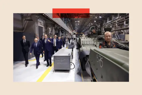Getty Images Vladimir Putin visits a tank factory in the Urals
