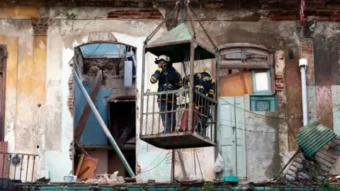 EPA Rescuers work on the site of a collapsed building in Havana, Cuba, 04 October 2023.