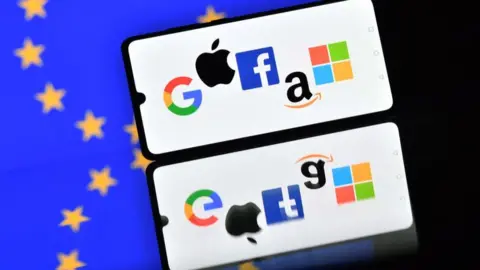 Getty Images Smartphone displays Google, Apple, Facebook, Amazon and Microsoft logos against EU flag background