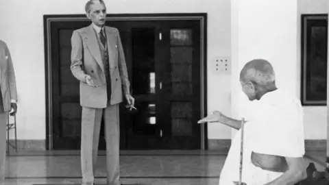 Getty Images Muhammad Ali Jinnah seen arguing with Mohandas Gandhi about partition outside Jinnah's house in 1939